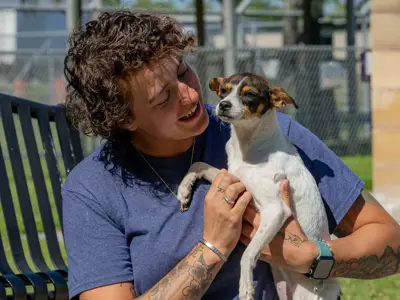 woman with small dog