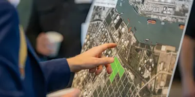 Person Pointing at Map