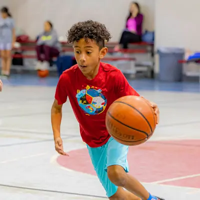 Boy dribbling basketball