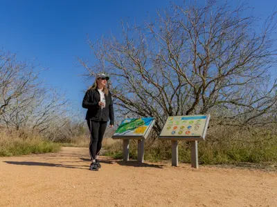 Woman walking through trail