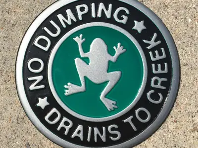 No Dumping Marker, Drains to Creek