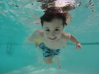 Boy swimming underwater 