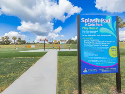 sign in front of Cole Park Splash Pad