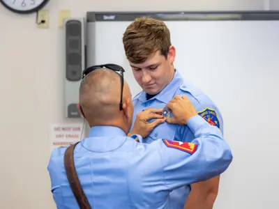 Firefighter receiving badge